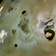 Loki, an overturning lava lake, is the dark horseshoe-shaped structure seen at far right.